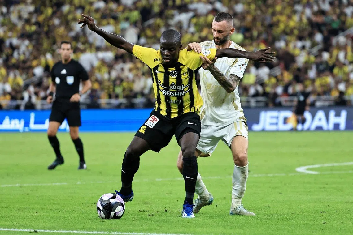 Soccer Football - Saudi Pro League - Al Ittihad v Al Nassr - King Abdullah Sport City, Jeddah, Saudi Arabia - December 6, 2024 Al Nassr's Marcelo Brozovic in action with Al Ittihad's N'Golo Kante REUTERS/Stringer