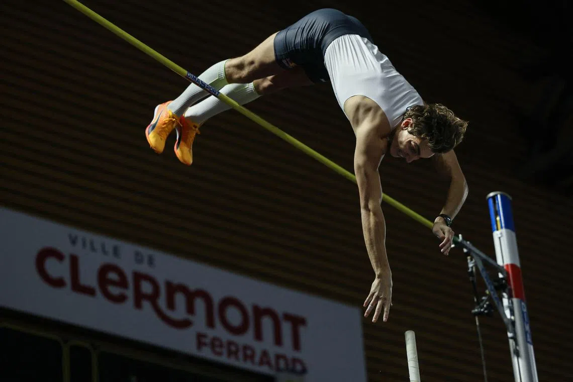 Swedish athlete Armand Duplantis clears the bar as he sets a new world record, on Feb 25, 2023.