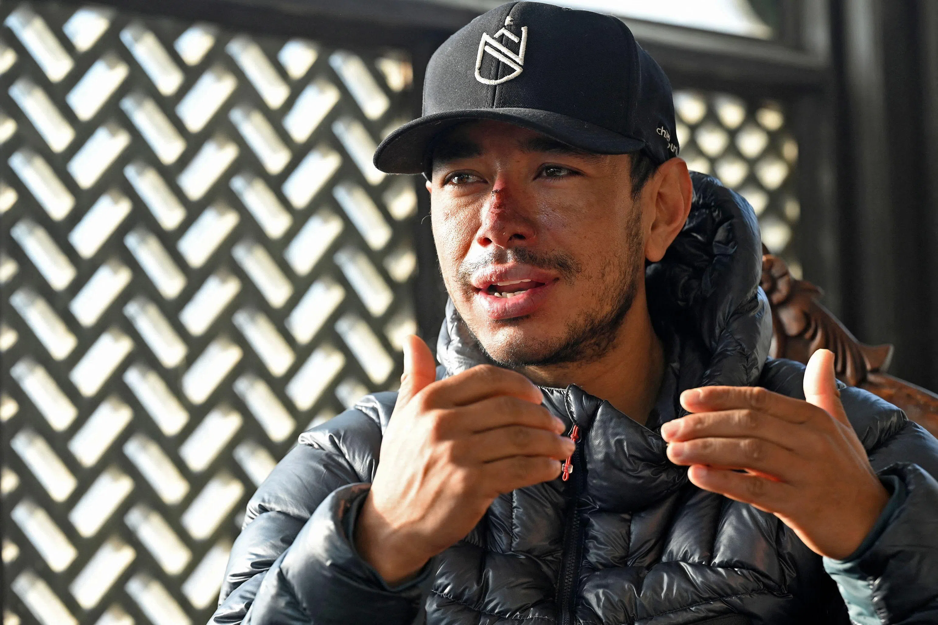 (FILES) In this picture taken on January 21, 2021, Nepali mountaineer Nirmal Purja speaks during an interview with AFP in Skardu, a city district of the Gilgit-Baltistan region in northern Pakistan. Renowned climber Nirmal Purja was among 10 missing after an avalanche in northern Pakistan where they were on a climbing expedition, the country's alpine club said on July 31, 2026. (Photo by Aamir QURESHI / AFP) / TO GO WITH Nepal-Pakistan-Mountaineering-Nirmal Purja, PROFILE by Zain Zaman Janjua, with Cyril Belaud in Islamabad