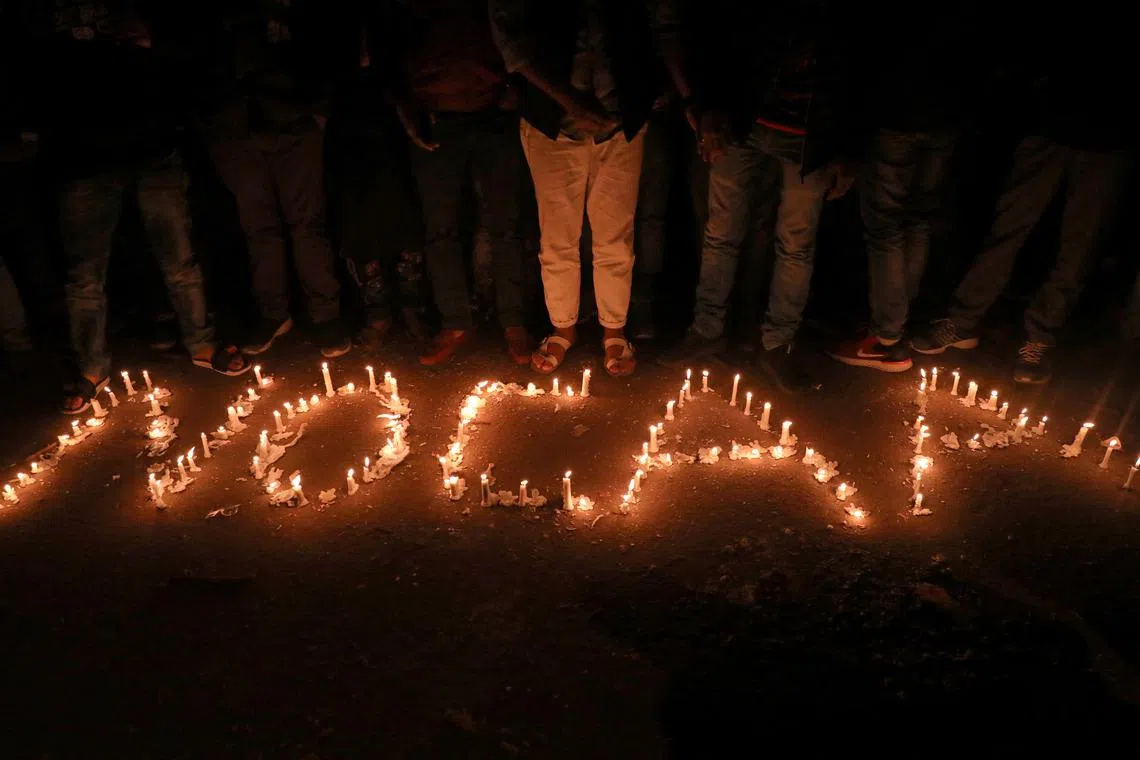 FILE PHOTO: Candles spell out \"No CAA\" during a protest against the Citizenship Amendment Act, a new citizenship law, in New Delhi, India, December 29, 2019. REUTERS/Anushree Fadnavis/File Photo