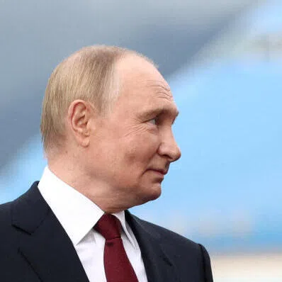 Moves to withdraw support for Ukraine by US President Donald Trump (right) is helping Moscow’s aggression against its neighbour, says the writer.