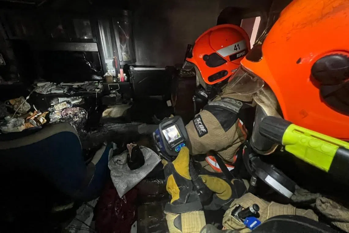 SCDF said the living room of a unit on the first storey was on fire when they arrived.