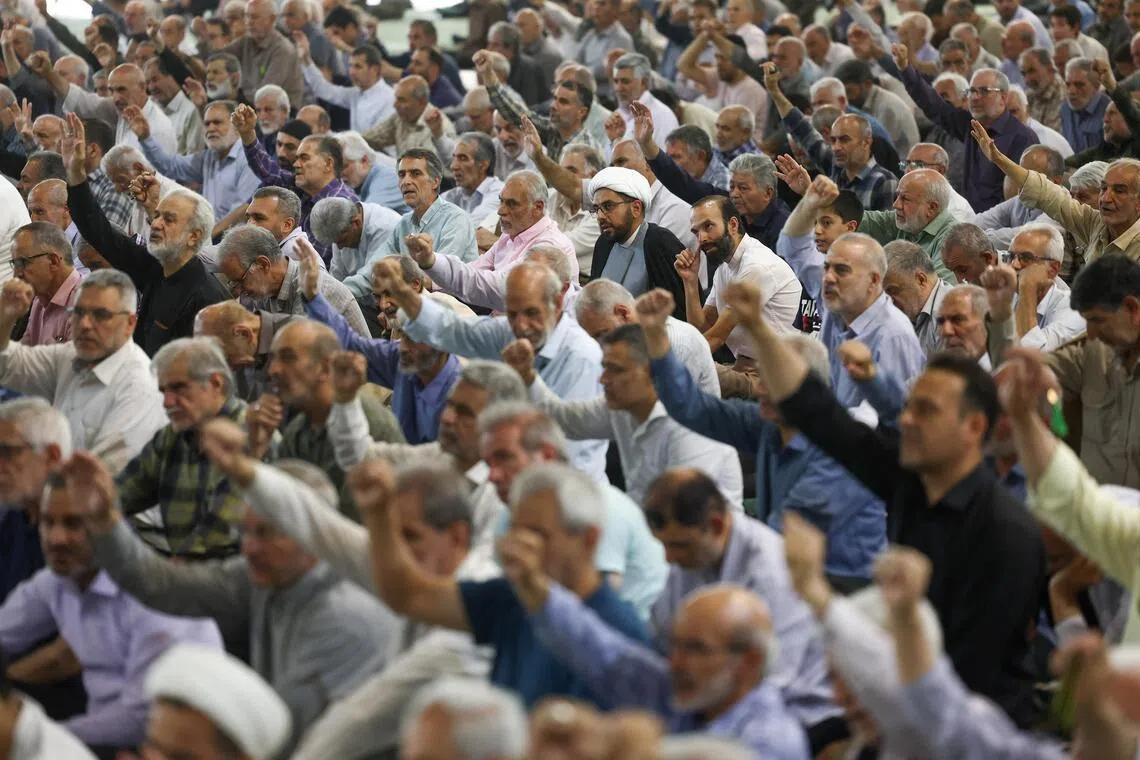 People attending Friday prayer in Tehran amid hopes Iran and the US will ink a peace deal by June 14.