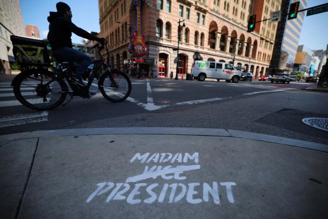 A sign supporting Democratic presidential nominee and U.S. Vice President Kamala Harris is painted on the sidewalk ahead of her debate with Republican presidential nominee and former U.S. President Donald Trump in Philadelphia, Pennsylvania, U.S., September 9, 2024.  REUTERS/Brian Snyder