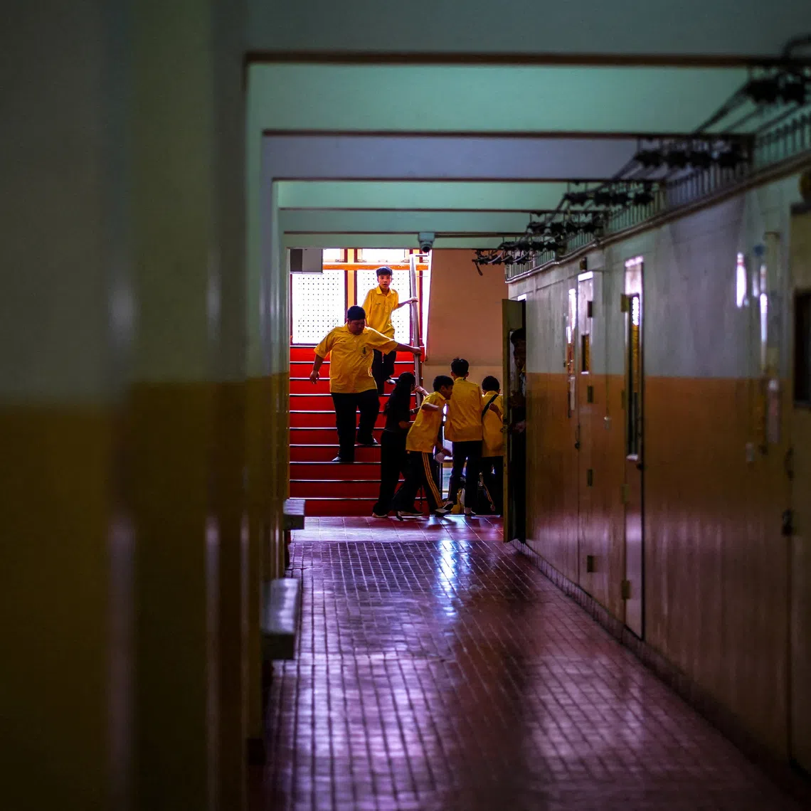 Students taking part in a “run, hide, fight” exercise at the Surasamontree School in Bangkok on Aug 19.