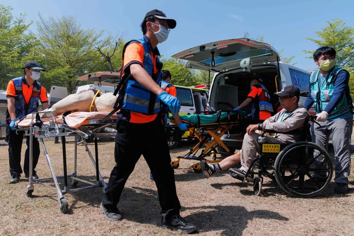 People take part in an emergency response drill in Tainan on March 27, 2025.  