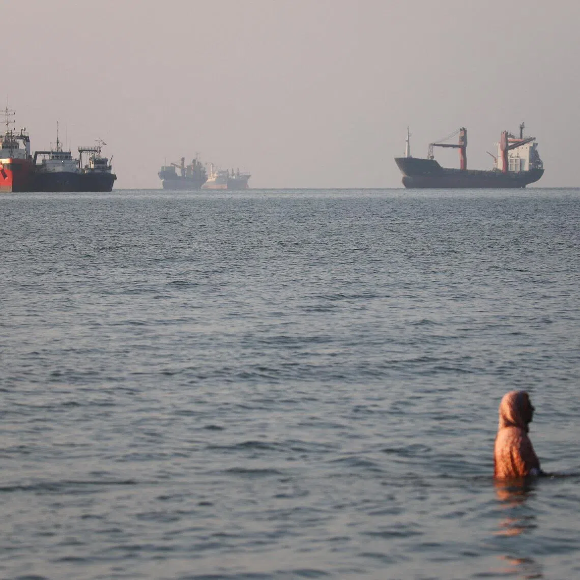 Vessels in the Strait of Hormuz near the beach of Bandar Abbas, Iran.   