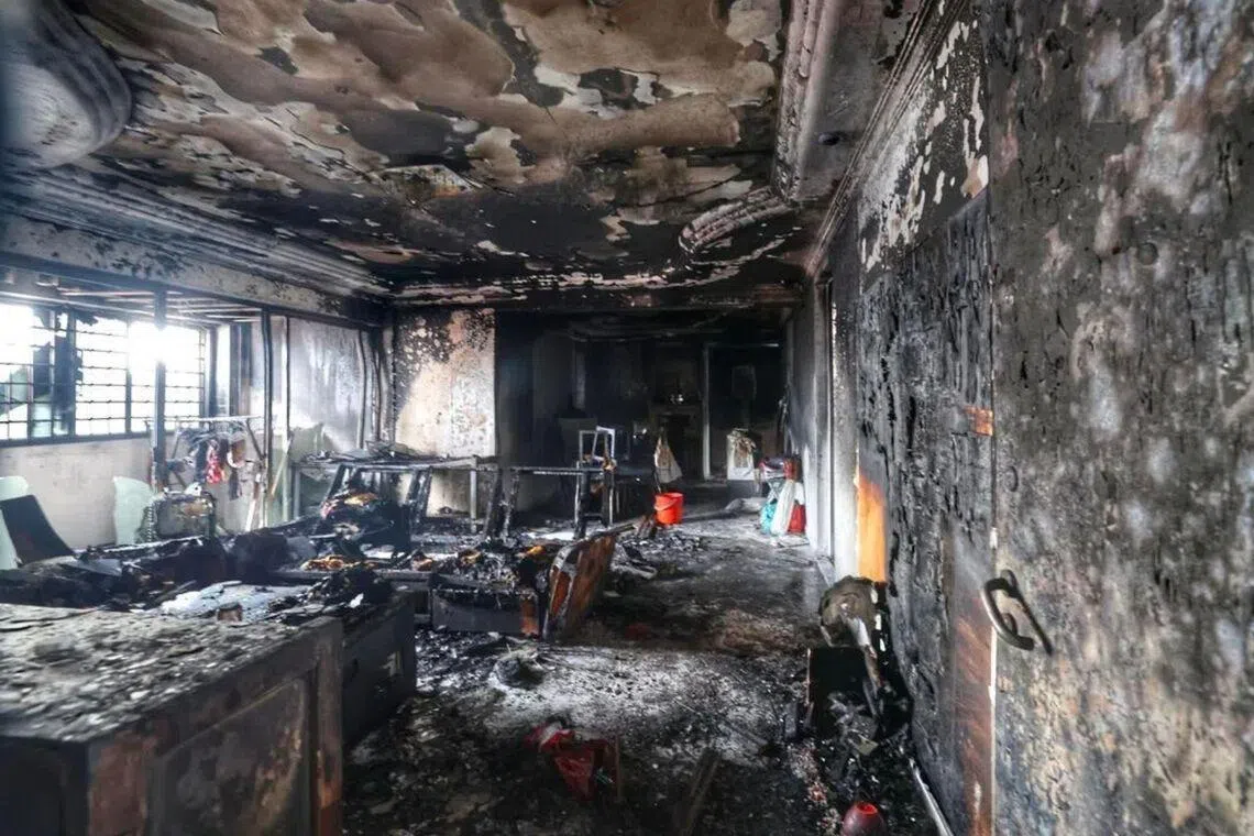 The walls and ceiling of the HDB flat in Jurong West were left blackened by the fire.