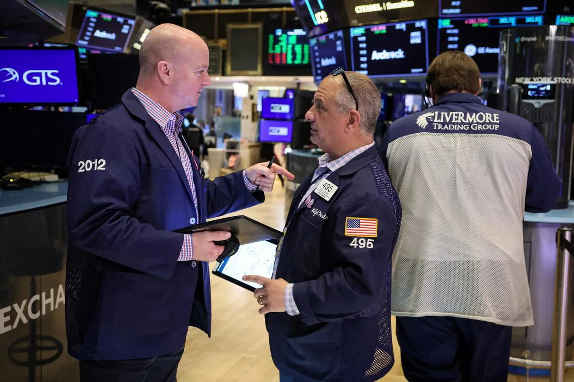Traders work on the floor of the New York Stock Exchange, in New York City.    