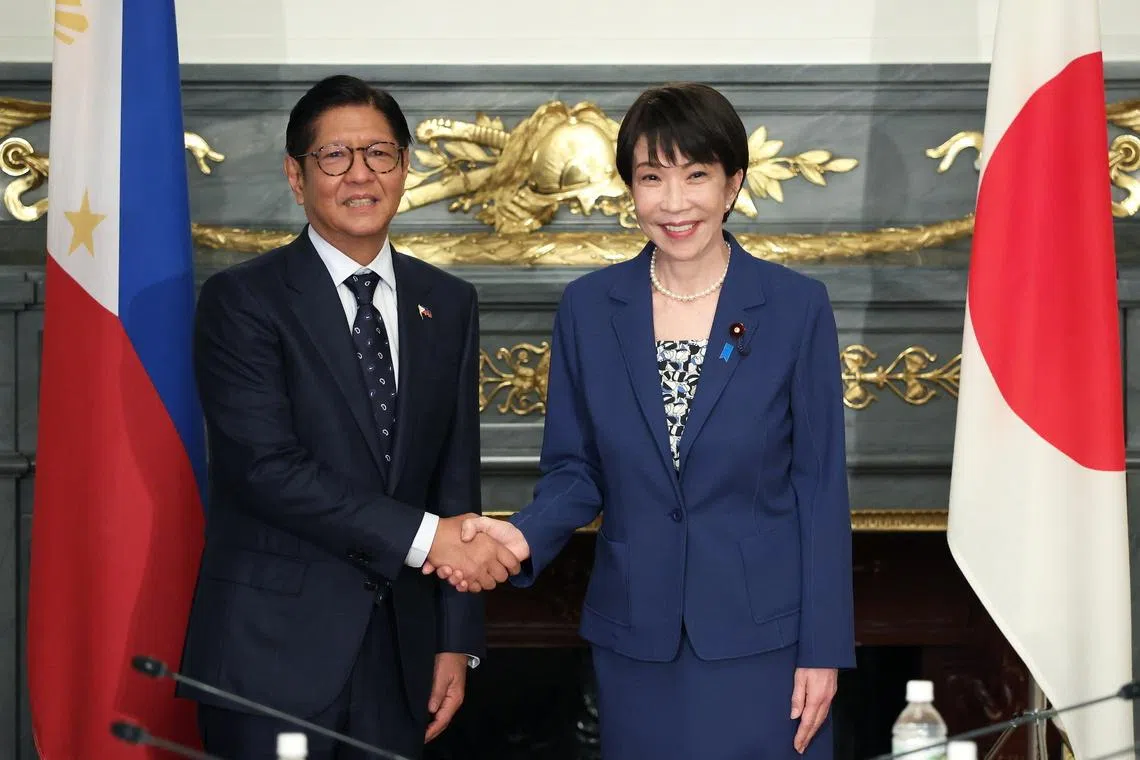 epa12999742 Japan's Prime Minister Sanae Takaichi (R) and Philippines' President Ferdinand Marcos Jr. (L) shake hands before a summit meeting at the Akasaka Palace state guest house in Tokyo, Japan, 28 May 2026.  EPA/Kiyoshi Ota / POOL