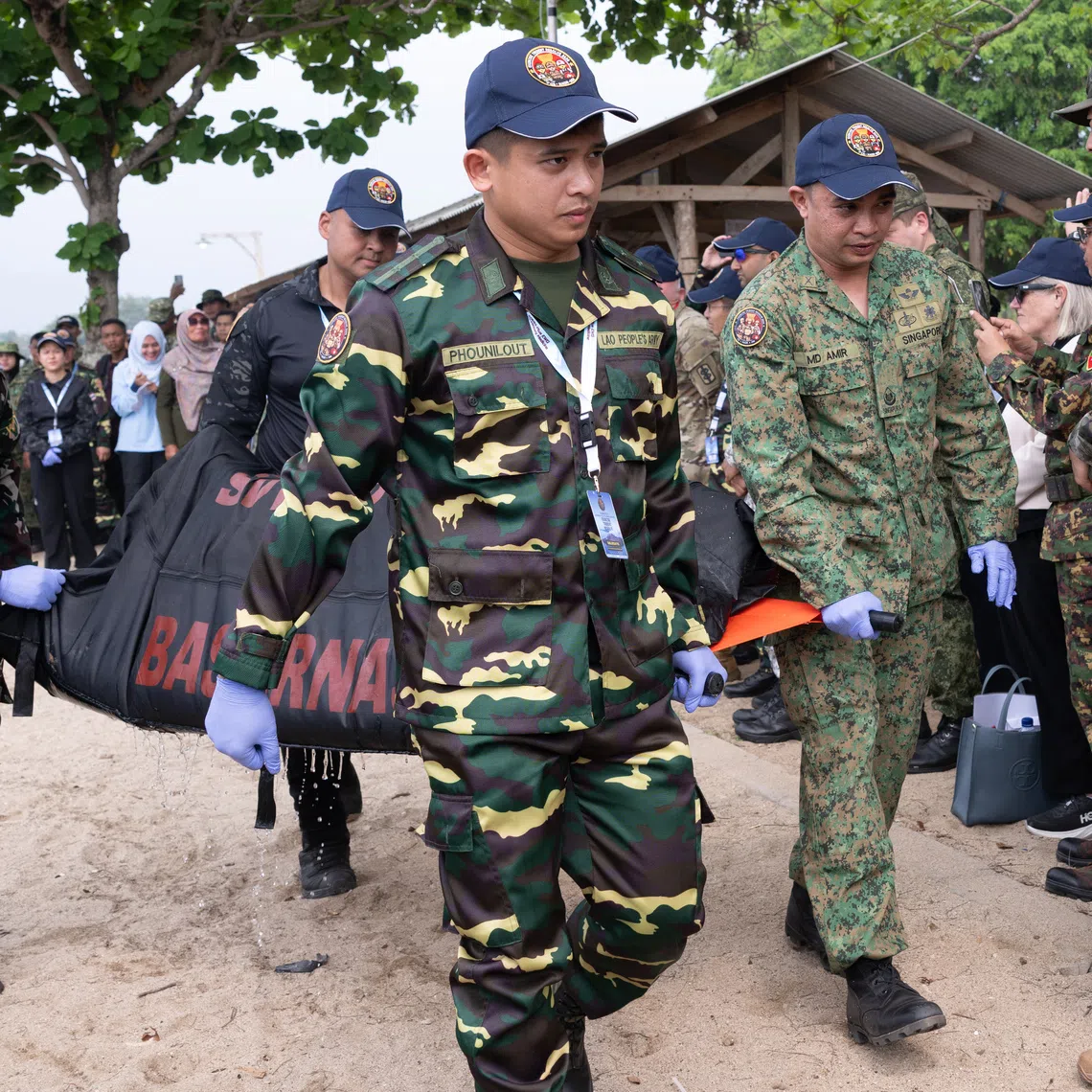 Personnel from participating countries evacuating a simulated casualty during a search and rescue component of Exercise Trident Resolve 2026.