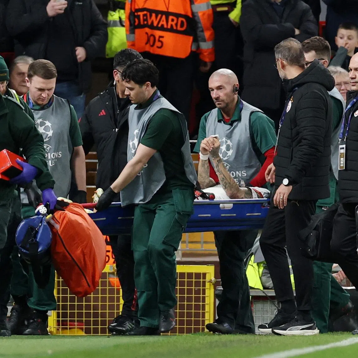 Soccer Football - UEFA Champions League - Round 16 - Second Leg - Liverpool v Galatasaray - Anfield, Liverpool, Britain - March 18, 2026 Galatasaray's Noa Lang is stretchered off after sustaining an injury REUTERS/Phil Noble