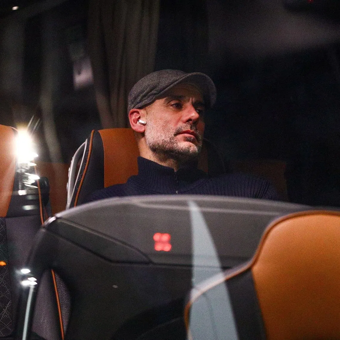 Soccer Football - UEFA Champions League - Bodo/Glimt v Manchester City - Aspmyra Stadion, Bodo, Norway - January 20, 2026 Manchester City manager Pep Guardiola looks dejected on the team bus after the match  Fredrik Varfjell/NTB via REUTERS
