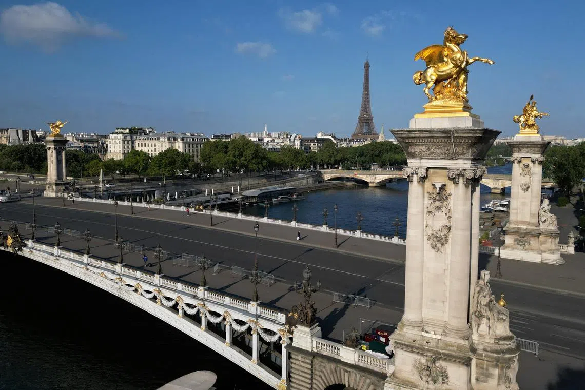 FILE PHOTO: An aerial view shows the Pont Alexandre III Bridge that will be the temporary venue for the triathlon and para triathlon competitions, and will provide a setting for the road cycling individual time trial, the swimming marathon competitions at the Paris 2024 Olympic and Paralympic Games, in Paris, France July 16, 2023. REUTERS/Pascal Rossignol