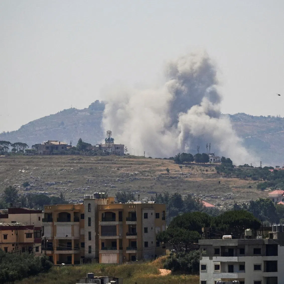 Smoke billows from southern Lebanon, following Israeli strikes, as seen from Nabatieh, Lebanon on June 8.