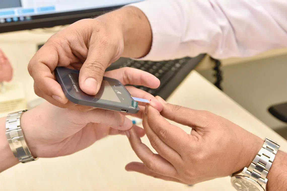A Glocumeter strip test check of a diabetic patient. There are about 10 million diabetes patients in Japan.
