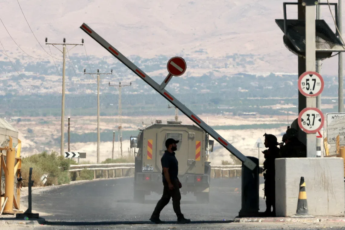 A man walks at a barrier, at the Allenby Bridge Crossing between the West Bank and Jordan, September 8, 2024. REUTERS/Ammar Awad/File Photo