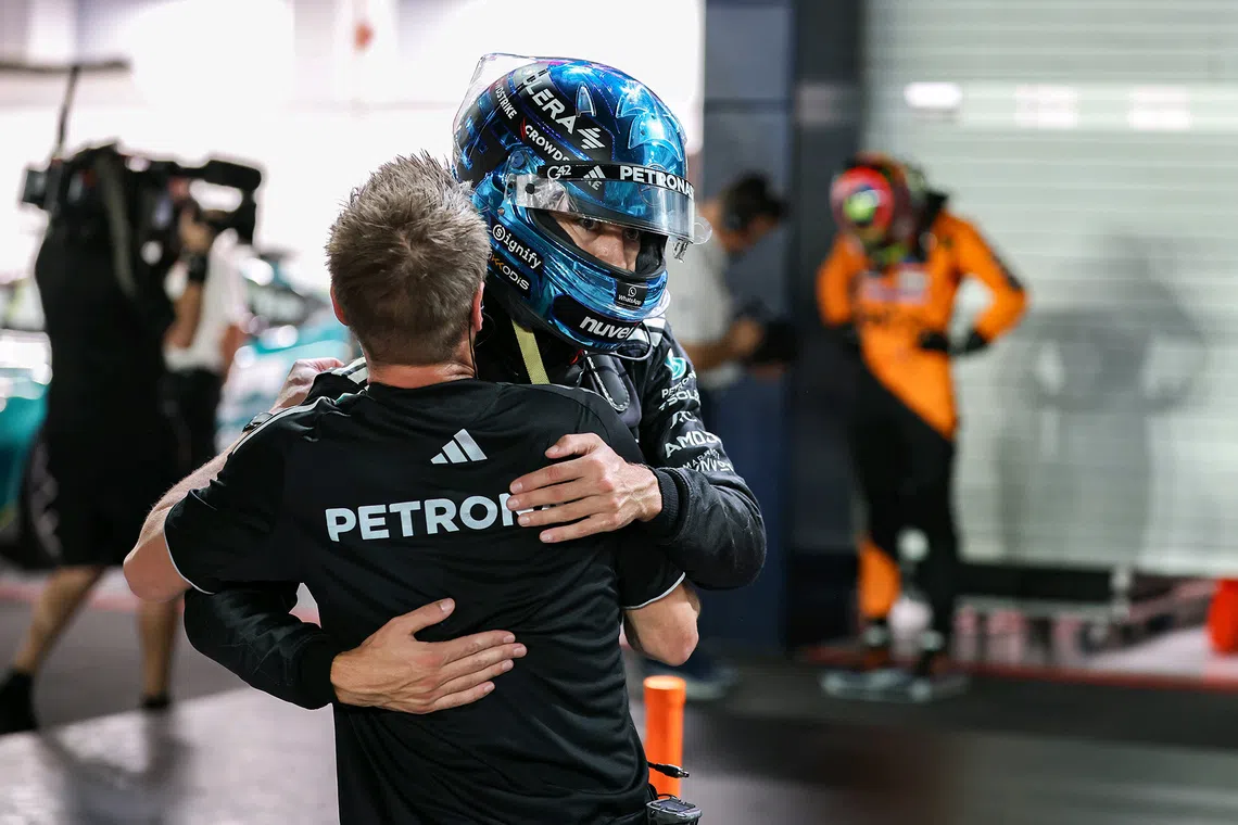 Mercedes' George Russell celebrating after clinching pole position in the qualifying session of the 2025 Formula One Singapore Airlines Singapore Grand Prix at the Marina Bay Street Circuit on Oct 4, 2025. 