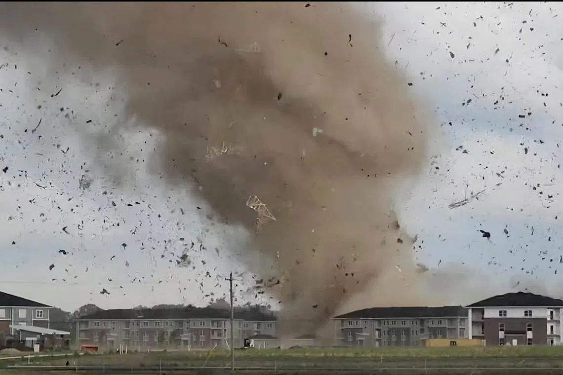 Debris is lifted into the air by a possible tornado during severe weather near Greenwood, Indiana.