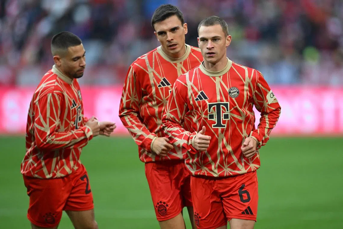 Bayern Munich's Joshua Kimmich (right), Joao Palhinha (centre) and Raphael Guerreiro during a warm-up session for their Bundesliga match against Union Berlin.