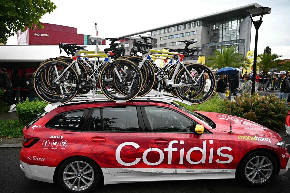 Bicycles sit on a roof-rack atop a Cofidis team vehicle before the start of the 3rd stage of the Tour de France between Valenciennes and Dunkirk in northern France, on July 7, 2025.