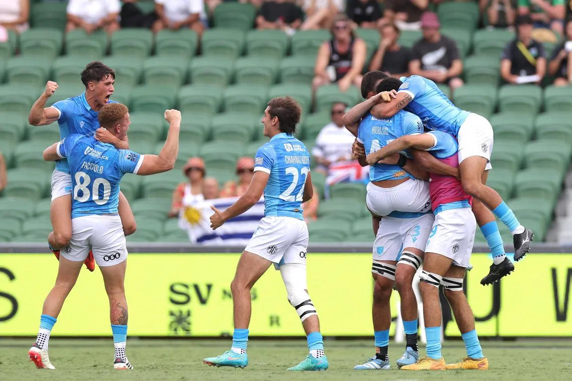 Uruguay players celebrate after defeating New Zealand in the Rugby SVNS Series at HBF Park in Perth, Australia on Jan 24, 2025.