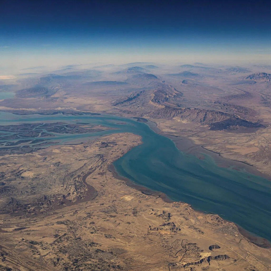 FILE PHOTO: An aerial view of the Iranian shores and the island of Qeshm in the strait of Hormuz, December 10, 2023. REUTERS/Stringer/File Photo