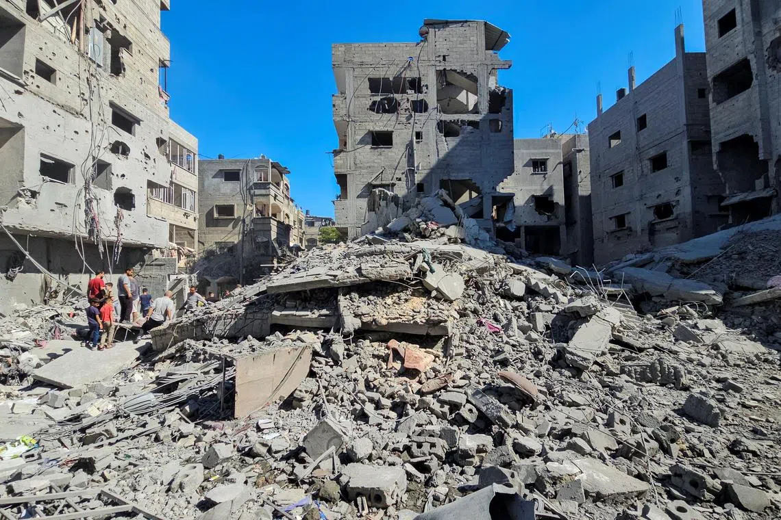 Israeli strikes reduce buildings in Beit Lahiya town in northern Gaza into rubble.