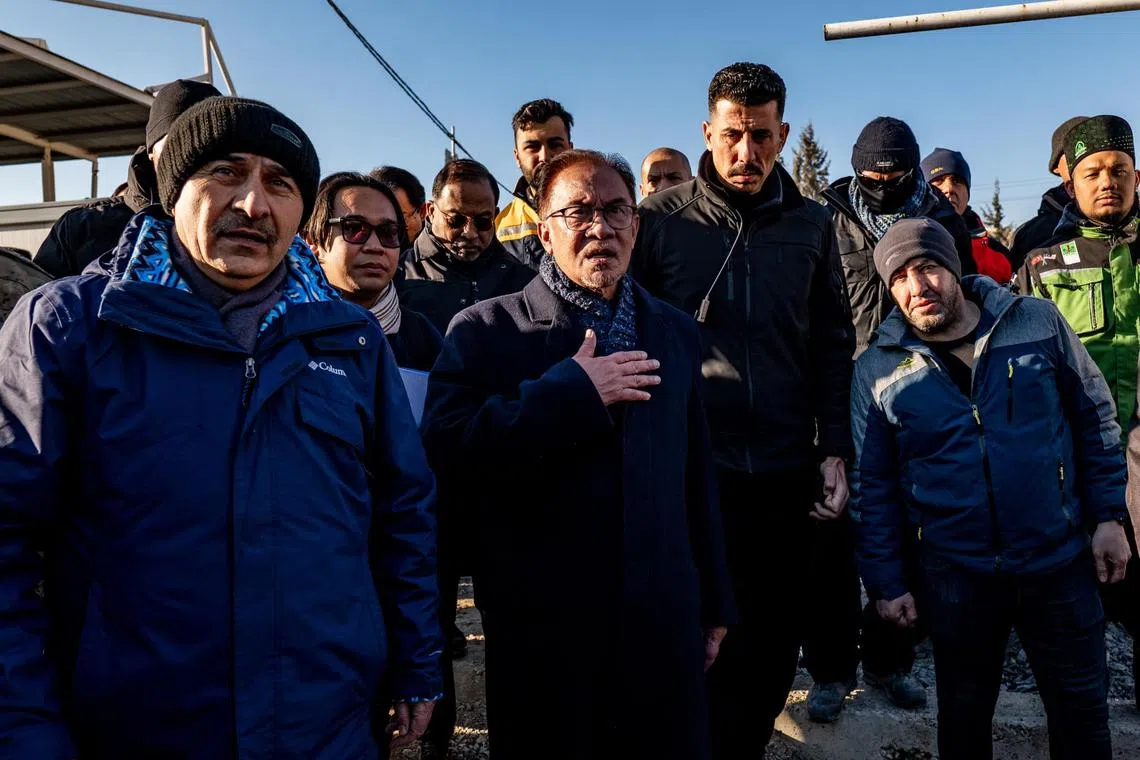 Malaysia PM Anwar Ibrahim inspecting the disaster site and meeting with Malaysian search and rescue personnel at Gaziantep, Turkey, on Feb 15, 2023.