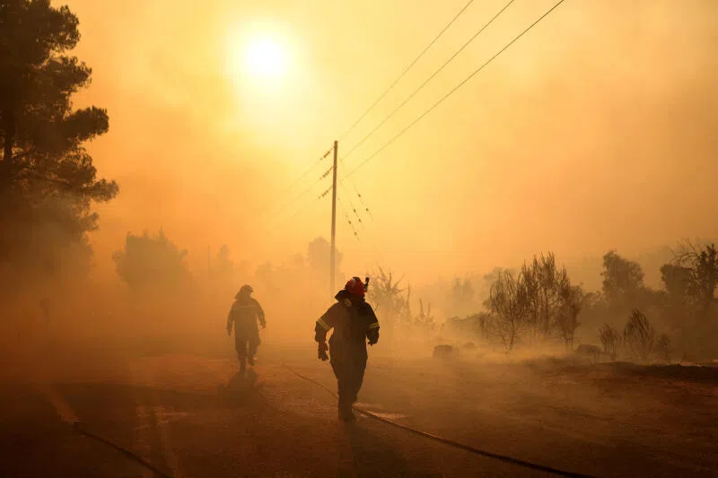 Firefighters battle a wildfire near the Agia Paraskevi village, Greece, on Aug 2, 2026.
