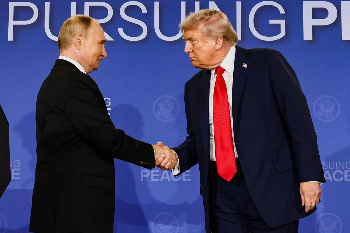 U.S. President Donald Trump and Russian President Vladimir Putin shake hands during a press conference following their meeting to negotiate an end to the war in Ukraine, at Joint Base Elmendorf-Richardson, in Anchorage, Alaska, U.S., August 15, 2025. REUTERS/Kevin Lamarque
