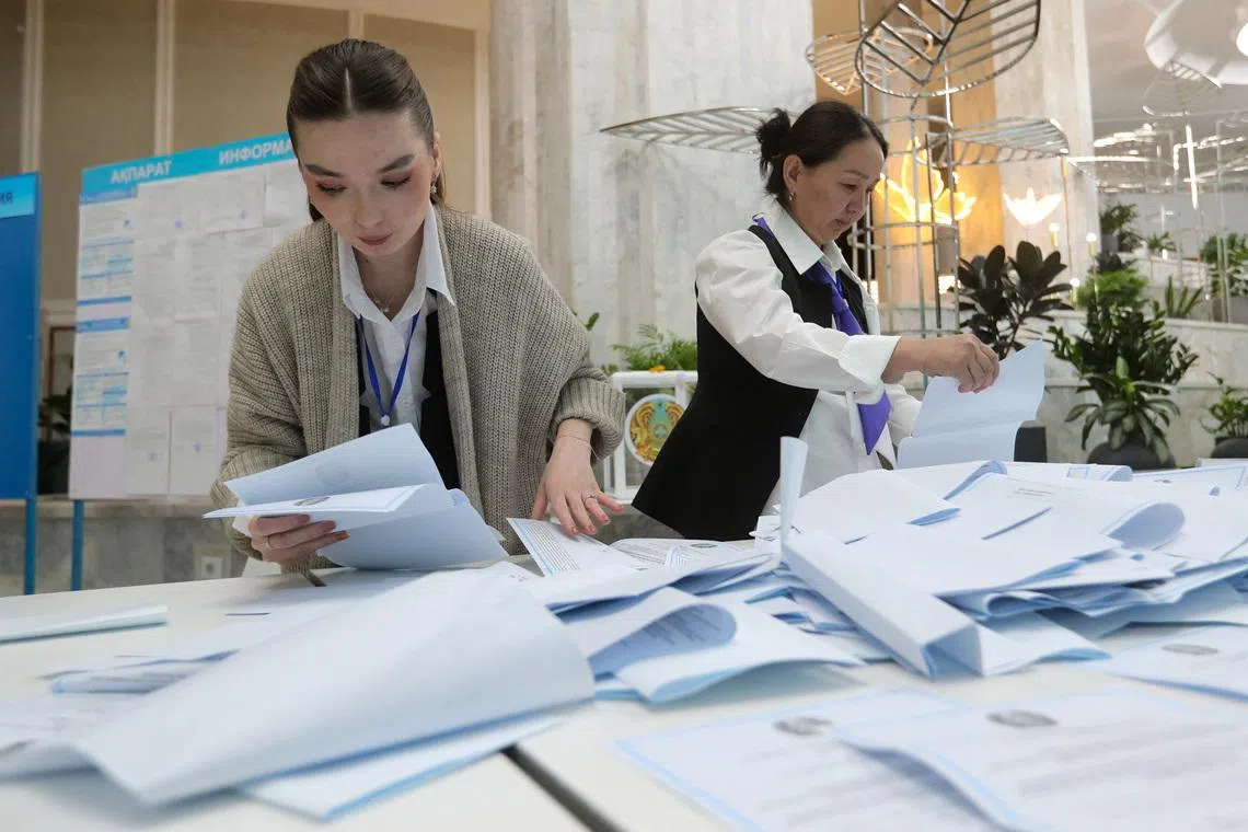 Members of a Kazakh electoral commission count votes after polling stations closed on the day of a referendum on a new constitution in Almaty, Kazakhstan, March 15, 2026. REUTERS/Pavel Mikheyev