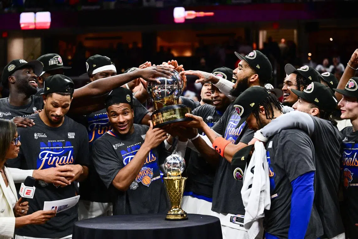 May 25, 2026; Cleveland, Ohio, USA; New York Knicks lift the 2026 Eastern Conference trophy after defeating the Cleveland Cavaliers in game four of the eastern conference finals for the 2026 NBA playoffs at Rocket Arena. Mandatory Credit: Ken Blaze-Imagn Images