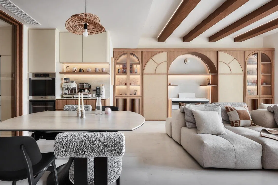 Sliding rattan panels reveal a built-in piano alcove, a feature that the couple keep hidden until guests arrive.