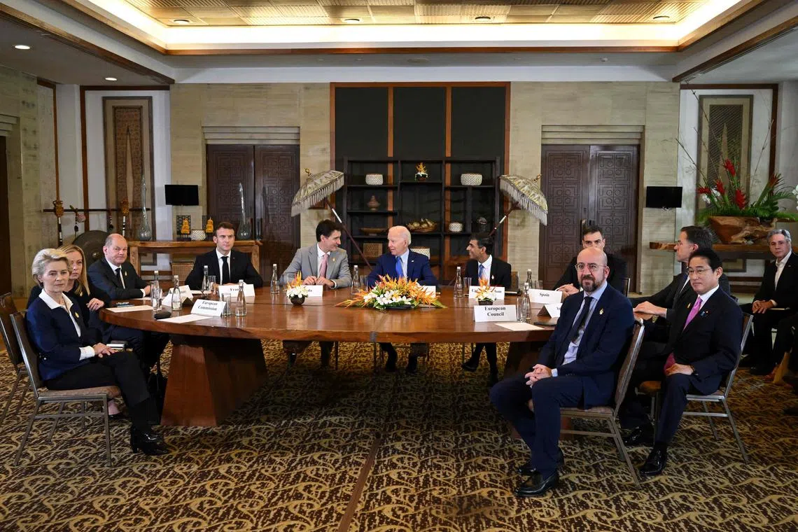 US President Joe Biden (c) and other G-7 leaders gather to hold an "emergency" meeting to discuss a missile strike on Polish territory near the border with Ukraine, on the sidelines of the G-20 leaders' summit in Nusa Dua, on the Indonesian resort island of Bali.
