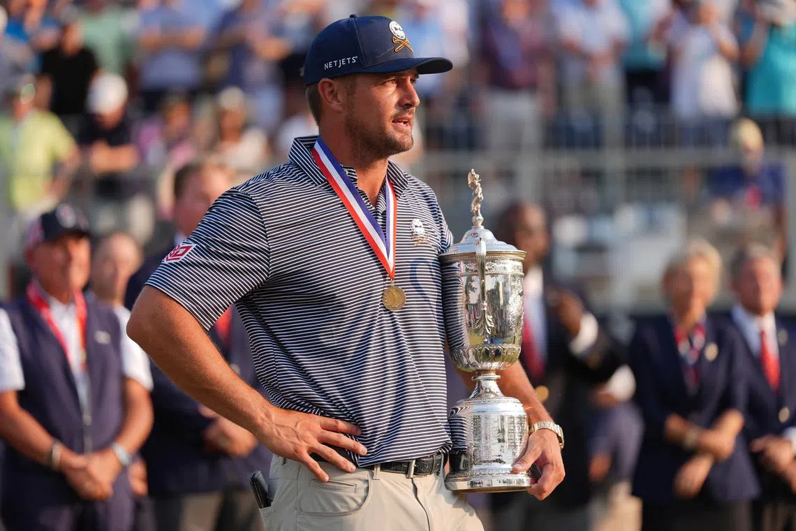 FILE PHOTO: Jun 16, 2024; Pinehurst, North Carolina, USA; Bryson DeChambeau celebrates with the trophy after winning the U.S. Open golf tournament. Mandatory Credit: Jim Dedmon-USA TODAY Sports