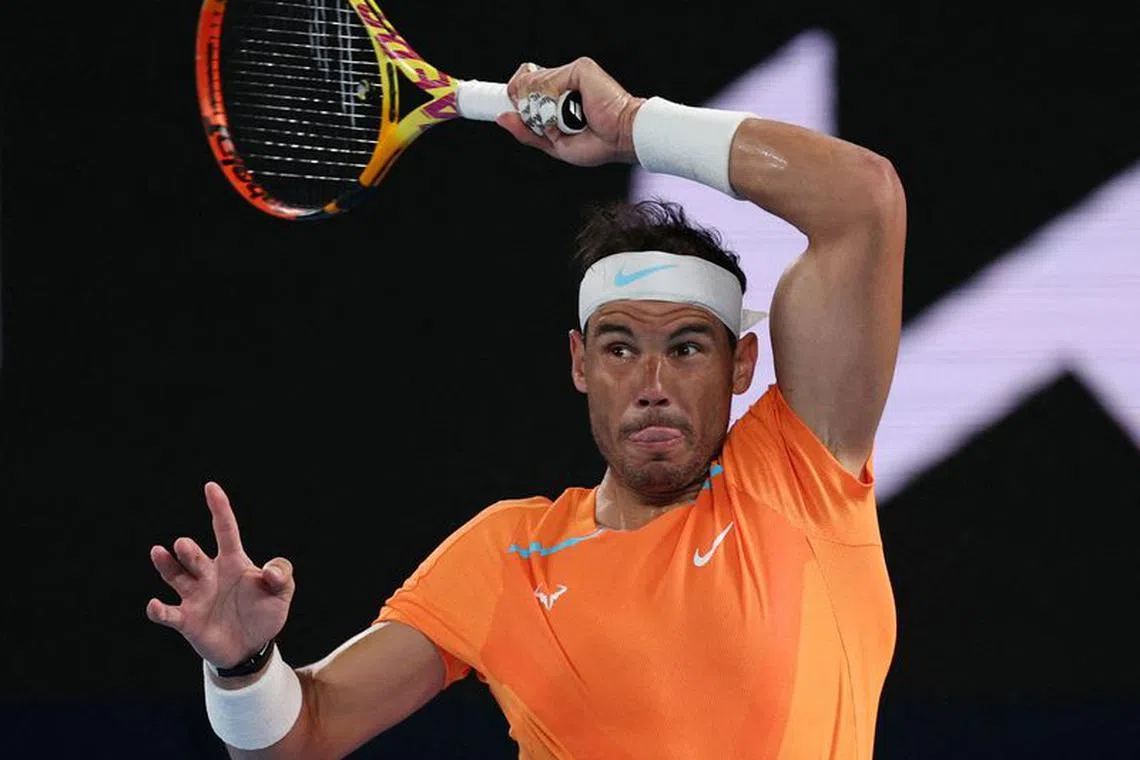 FILE PHOTO: Tennis - Australian Open - Melbourne Park, Melbourne, Australia - January 18, 2023 Spain's Rafael Nadal in action during his second round match against Mackenzie Mcdonald of the U.S. REUTERS/Loren Elliott/File Photo