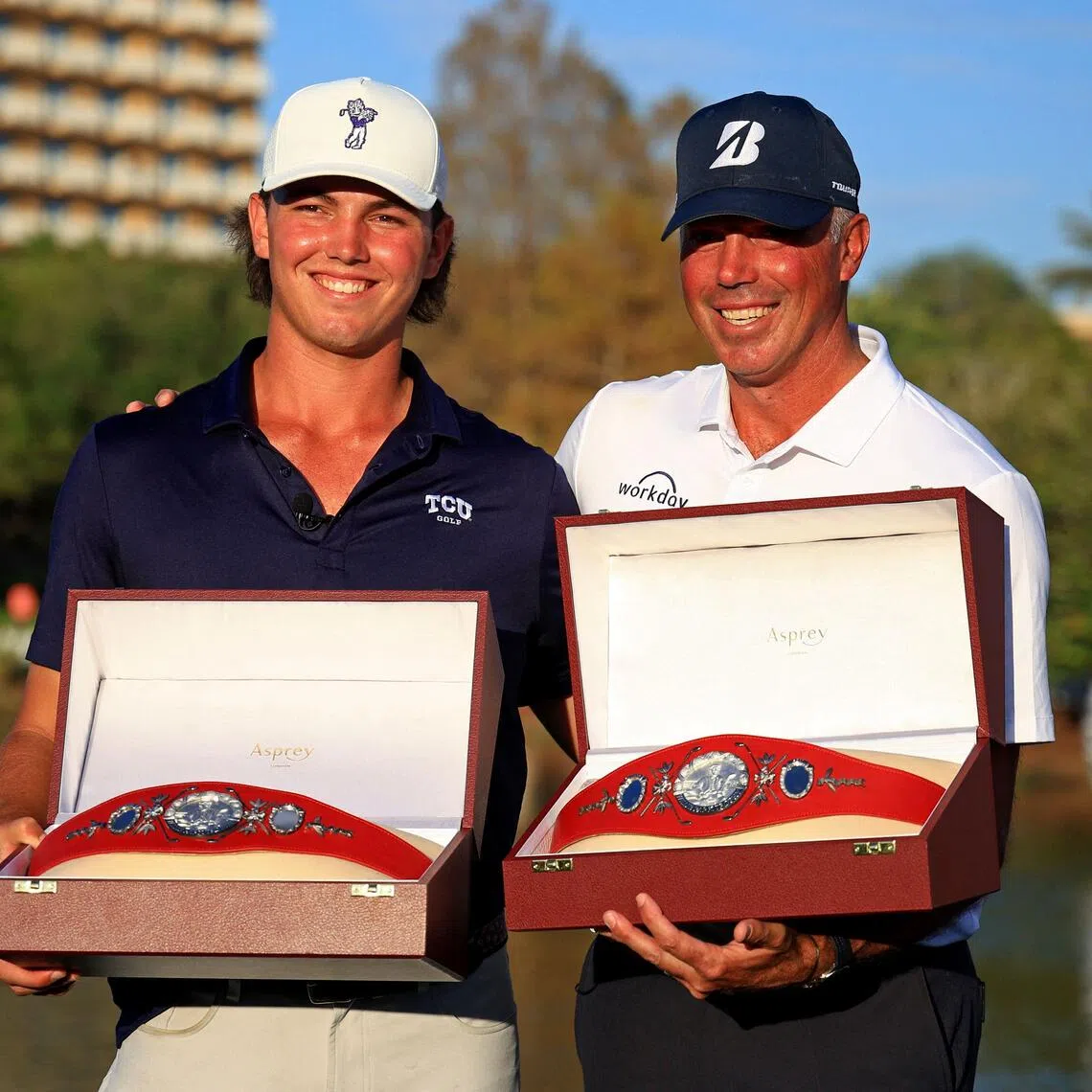 Cameron Kuchar and Matt Kuchar pose with the Willie Park Belts after winning the PNC Championship.