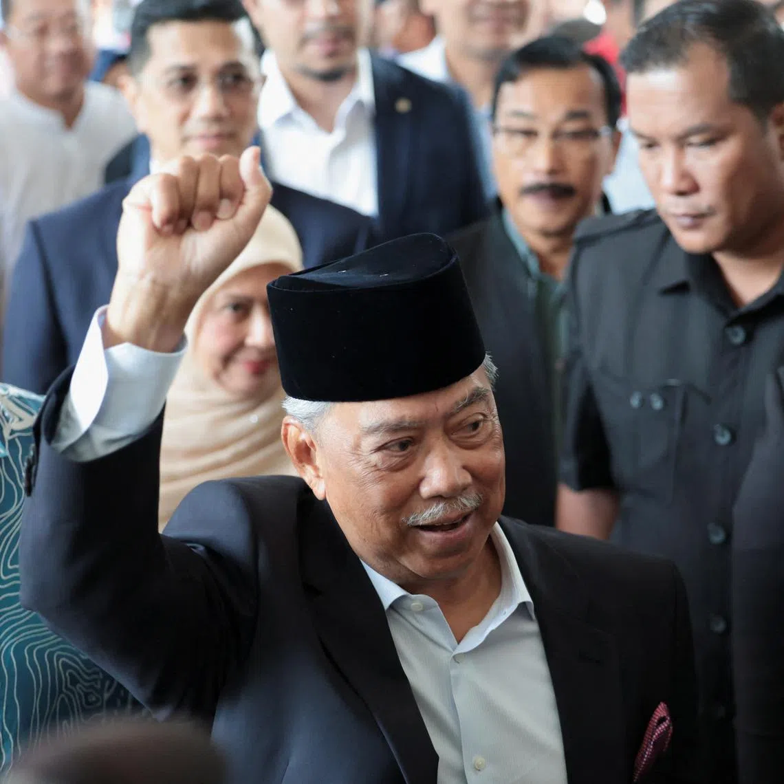 FILE PHOTO: Malaysian opposition leader and former premier Muhyiddin Yassin gestures as he arrives at the Gua Musang Sessions Court in Gua Musang, Malaysia August 27, 2024. REUTERS/Hasnoor Hussain/File photo