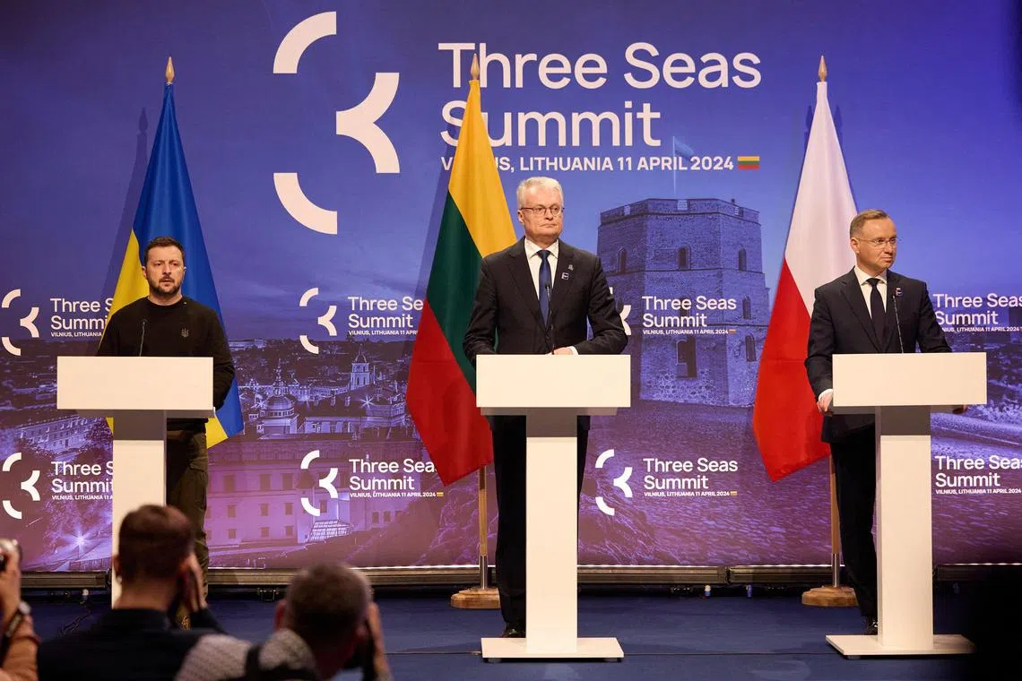 (From left) Ukrainian President Volodymyr Zelensky, Lithuanian President Gitanas Nauseda and Polish President Andrzej Duda address a joint press conference in Vilnius, Lithuania.