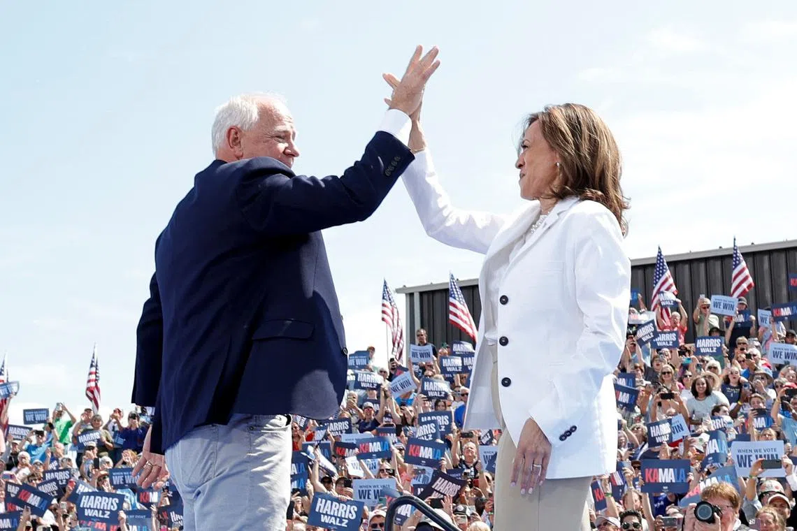 Democratic presidential candidate Kamala Harris and her new running mate, Minnesota Governor Tim Walz at a campaign rally in Eau Claire, Wisconsin, on Aug 7.