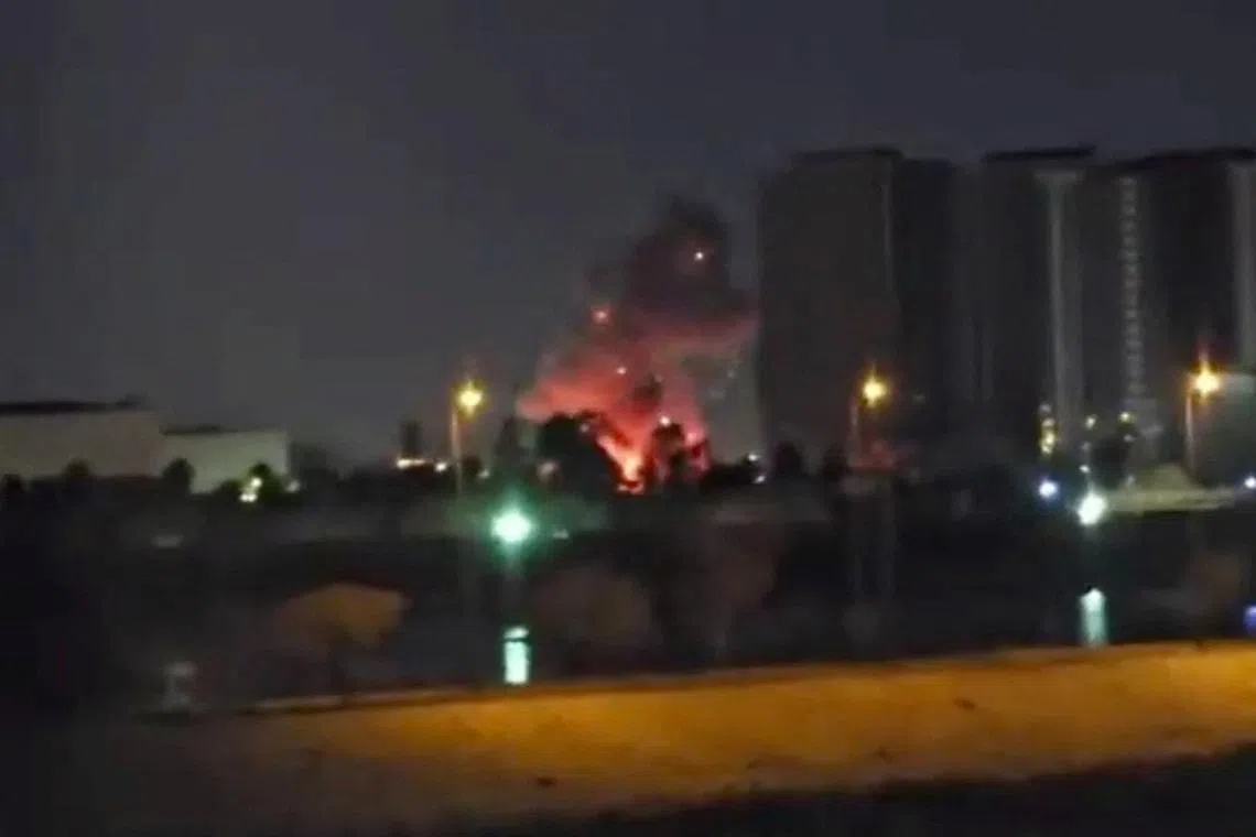 Smoke and fire rise during reported drone and rocket strikes at the U.S. embassy, according to Iraqi security sources, in Baghdad, Iraq, in this still image obtained from a social media video released on March 17, 2026. Social Media via REUTERS