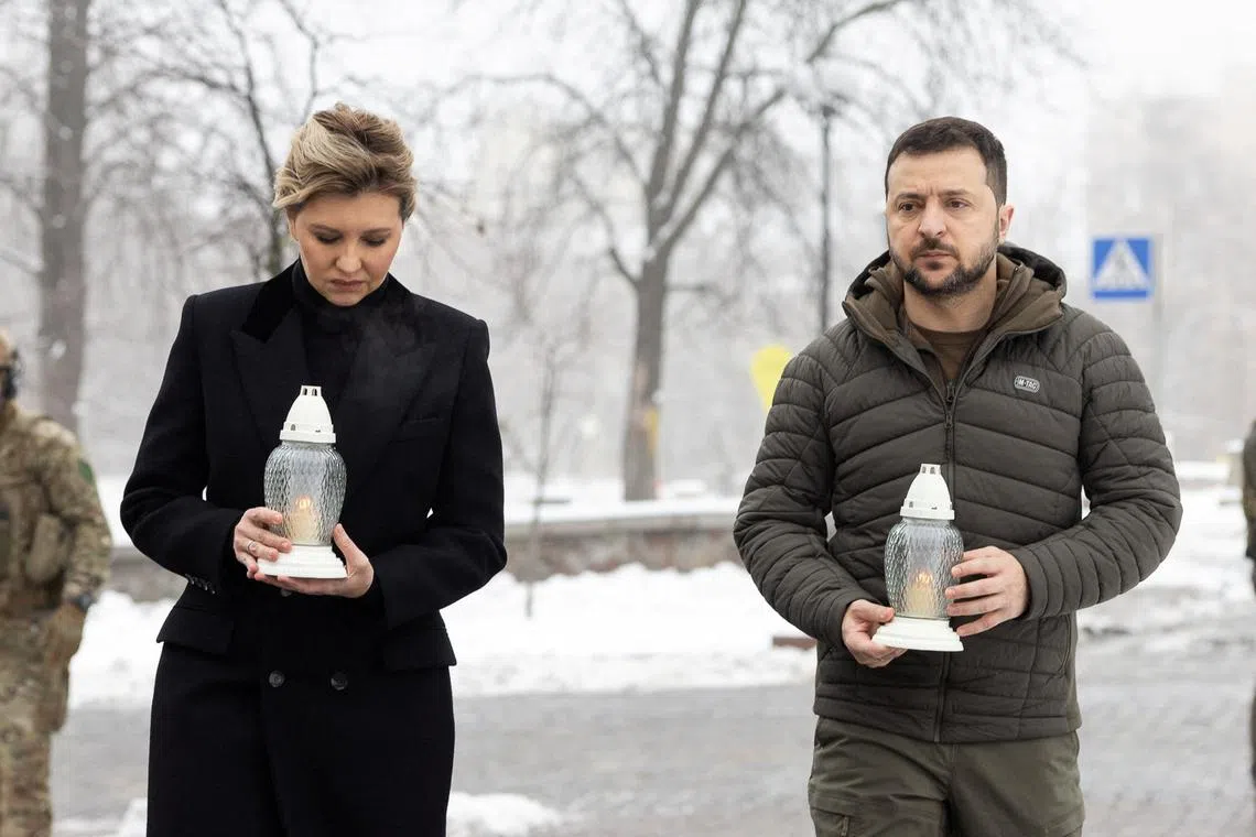Ukraine's President Volodymyr Zelensky and his wife Olena Zelenska attend a commemoration ceremony at a monument to the people killed during the pro-European Union protests of 2013/2014.