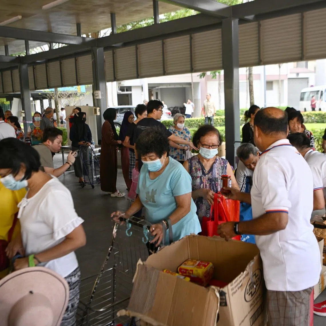 Grassroots volunteers teamed up with community organisations to give out free food and sundries to residents.