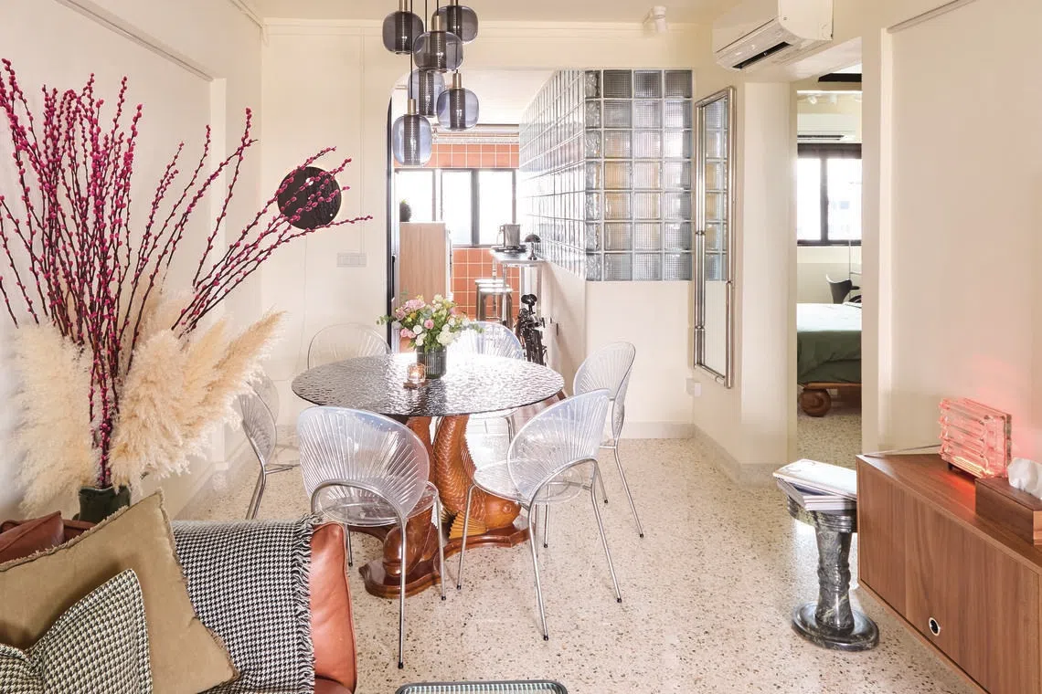 Wood, glass and terrazzo come together to create a cosy mix of textures in this HDB flat.