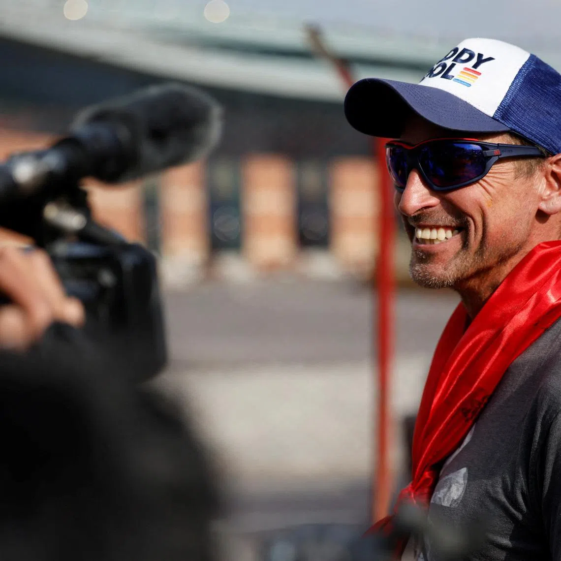 British climber Kenton Cool, 49, smiles while he speaks with the media personnel, upon his arrival at the airport, as he returns after completing his 17th ascent of Mount Everest, which is the most by any foreign climber, in Kathmandu, Nepal May 19, 2023. REUTERS/Navesh Chitrakar