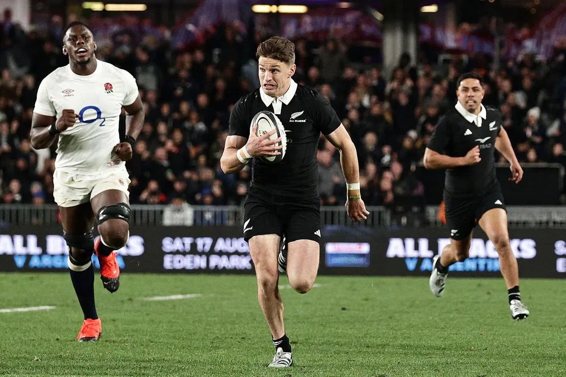 New Zealand’s Beauden Barrett running with the ball during the second rugby Test match between New Zealand and England at Eden Park in Auckland on July 13. He helped orchestrate a 24-17 come-from-behind win.
