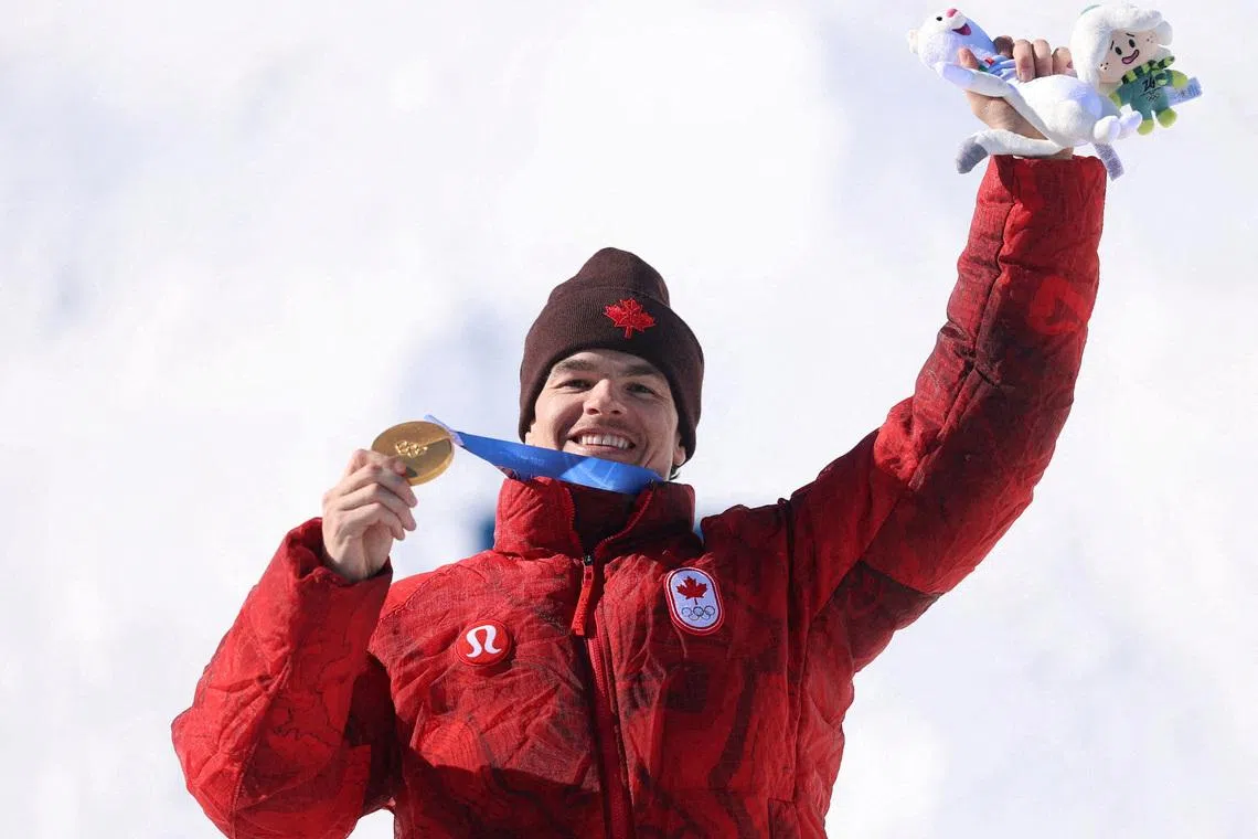 FILE PHOTO: Milano Cortina 2026 Olympics - Freestyle Skiing - Men's Dual Moguls Victory Ceremony - Livigno Aerials & Moguls Park, Livigno, Italy - February 15, 2026. Gold medallist Mikael Kingsbury of Canada celebrates on the podium during the victory ceremony REUTERS/Hannah Mckay/File Photo