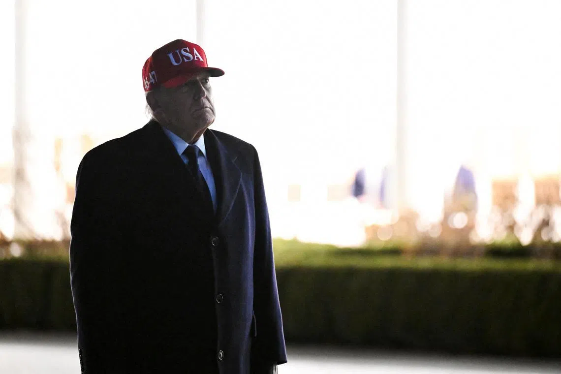 U.S. President Donald Trump looks at statues in the Rose Garden while returning to the White House, after Israel and the U.S. launched strikes on Iran, in Washington, D.C., U.S., March 1, 2026. REUTERS/Annabelle Gordon