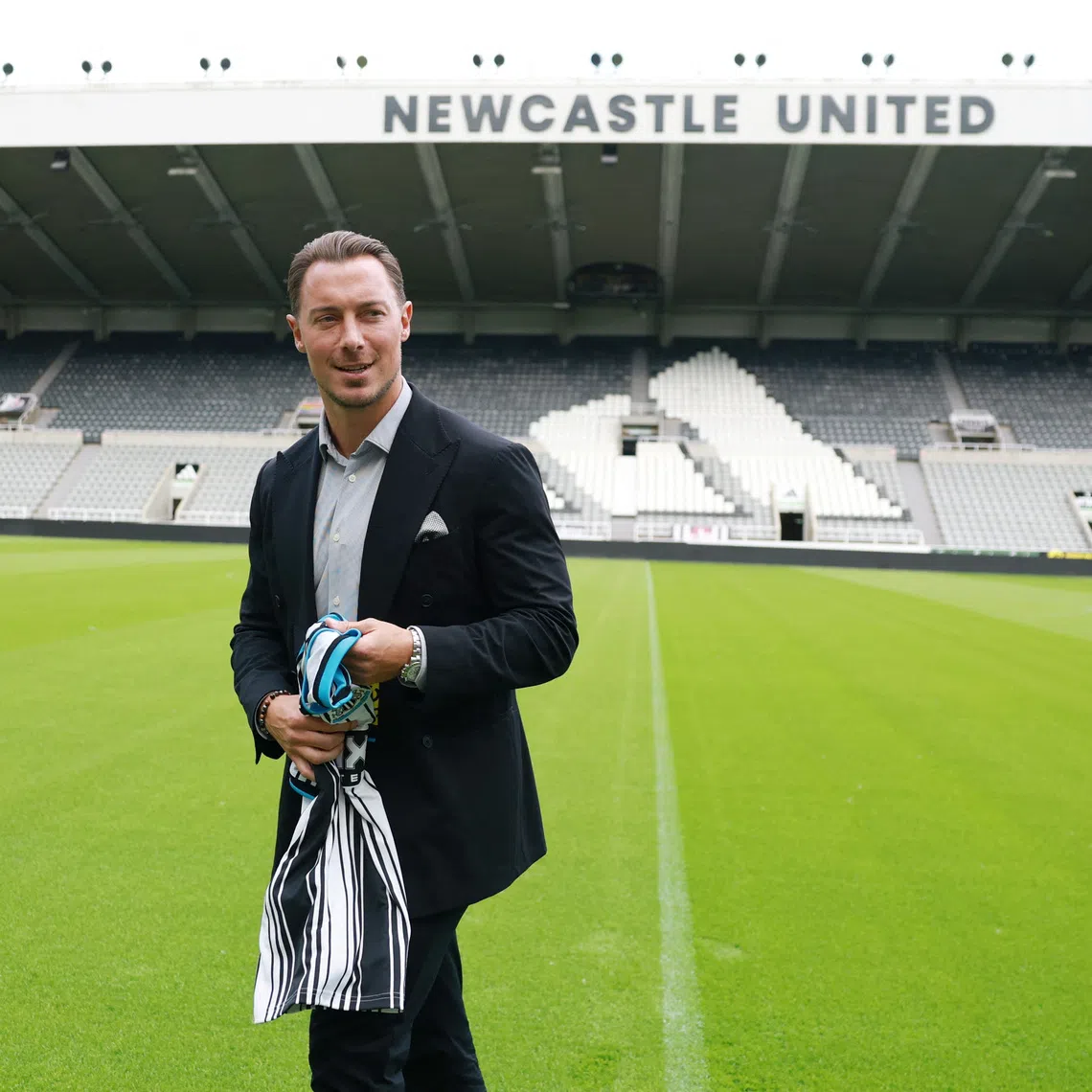 Soccer Football - Newcastle United - Matthias Jaissle Press Conference - St James' Park, Newcastle, Britain - August 11, 2026 Newcastle United manager Matthias Jaissle with the home kit on the pitch following his introductory press conference Action Images via Reuters/Lee Smith